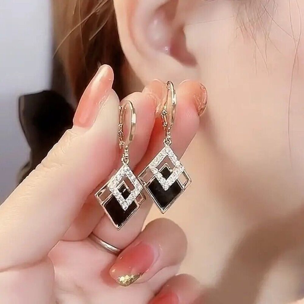 Exquisite Black and Gold Earrings with Accents